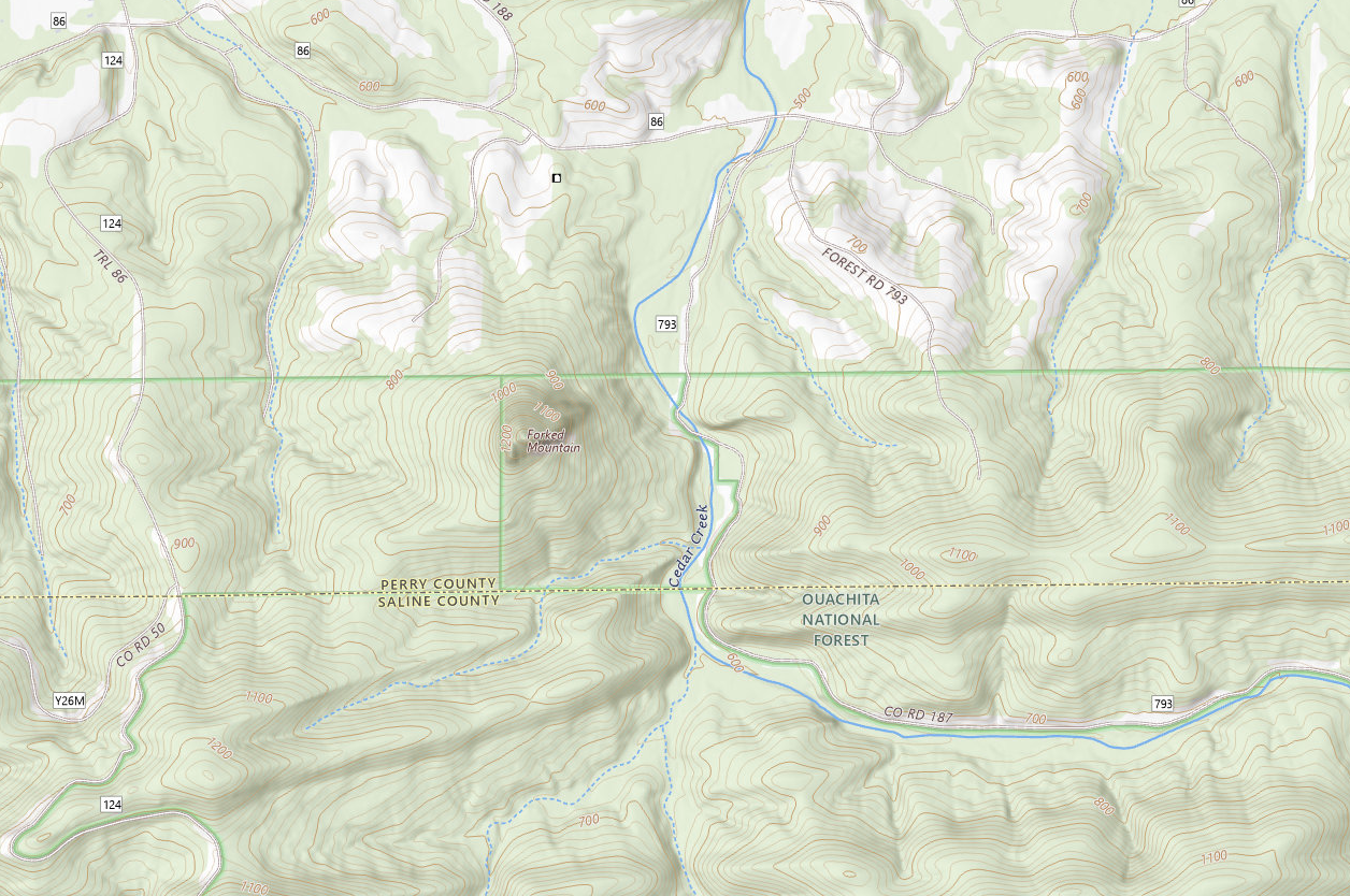 Topographic map showing Perry County and Saline County, highlighting roads, elevation contour lines, and Cedar Creek within the Ouachita National Forest.